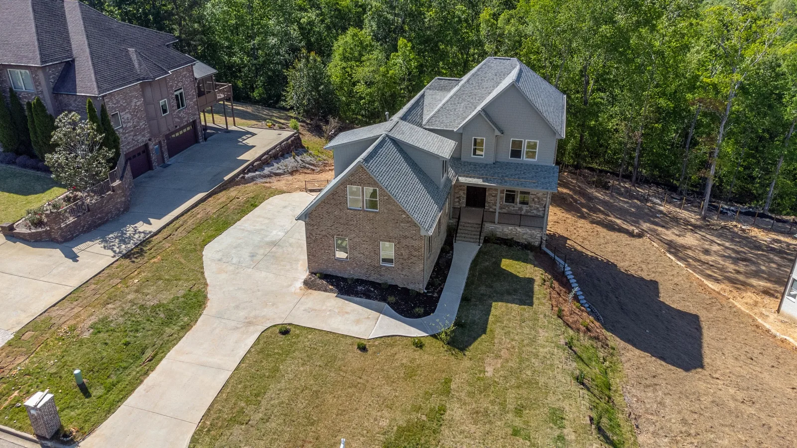 Aerial view of a residential property and surrounding site
